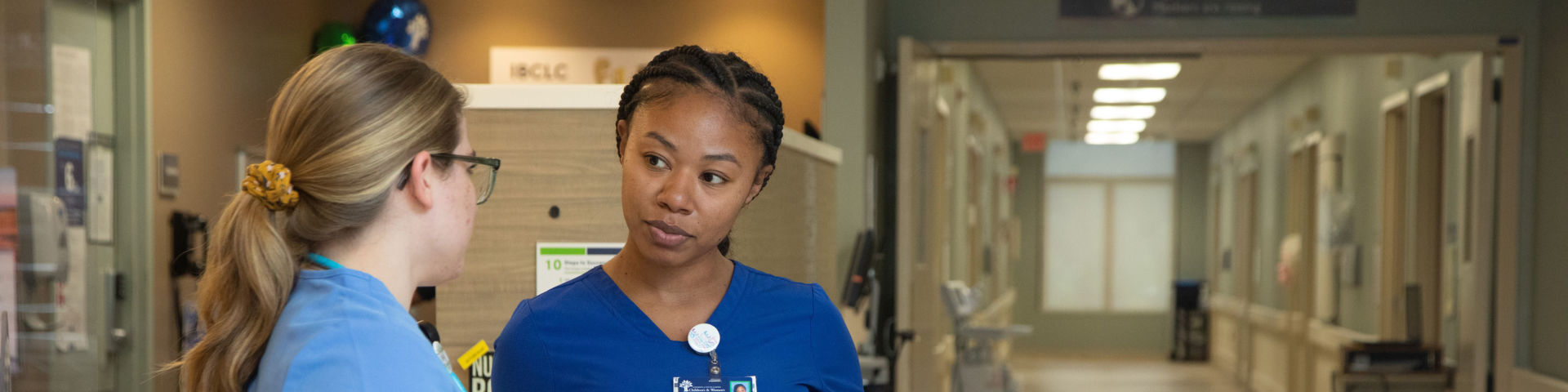 Employees have a discussion about patient care.