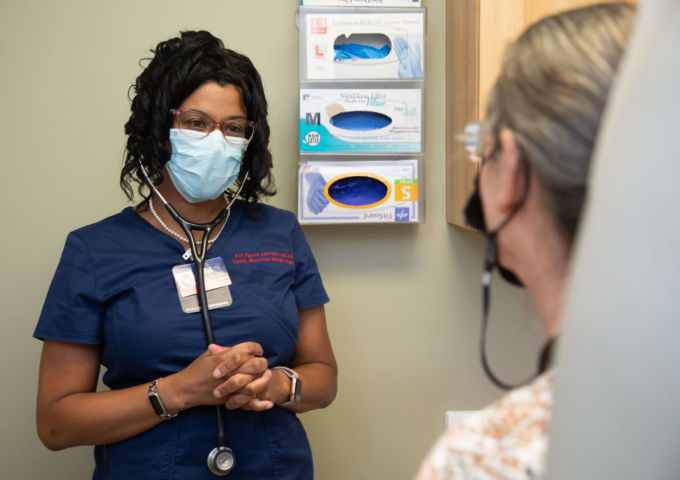 Ann Payne-Johnson, M.D., with a patient