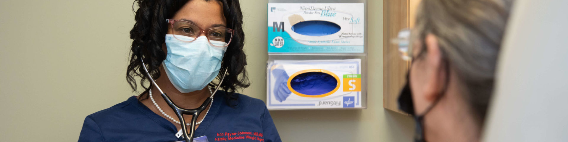 Ann Payne-Johnson, M.D., with a patient